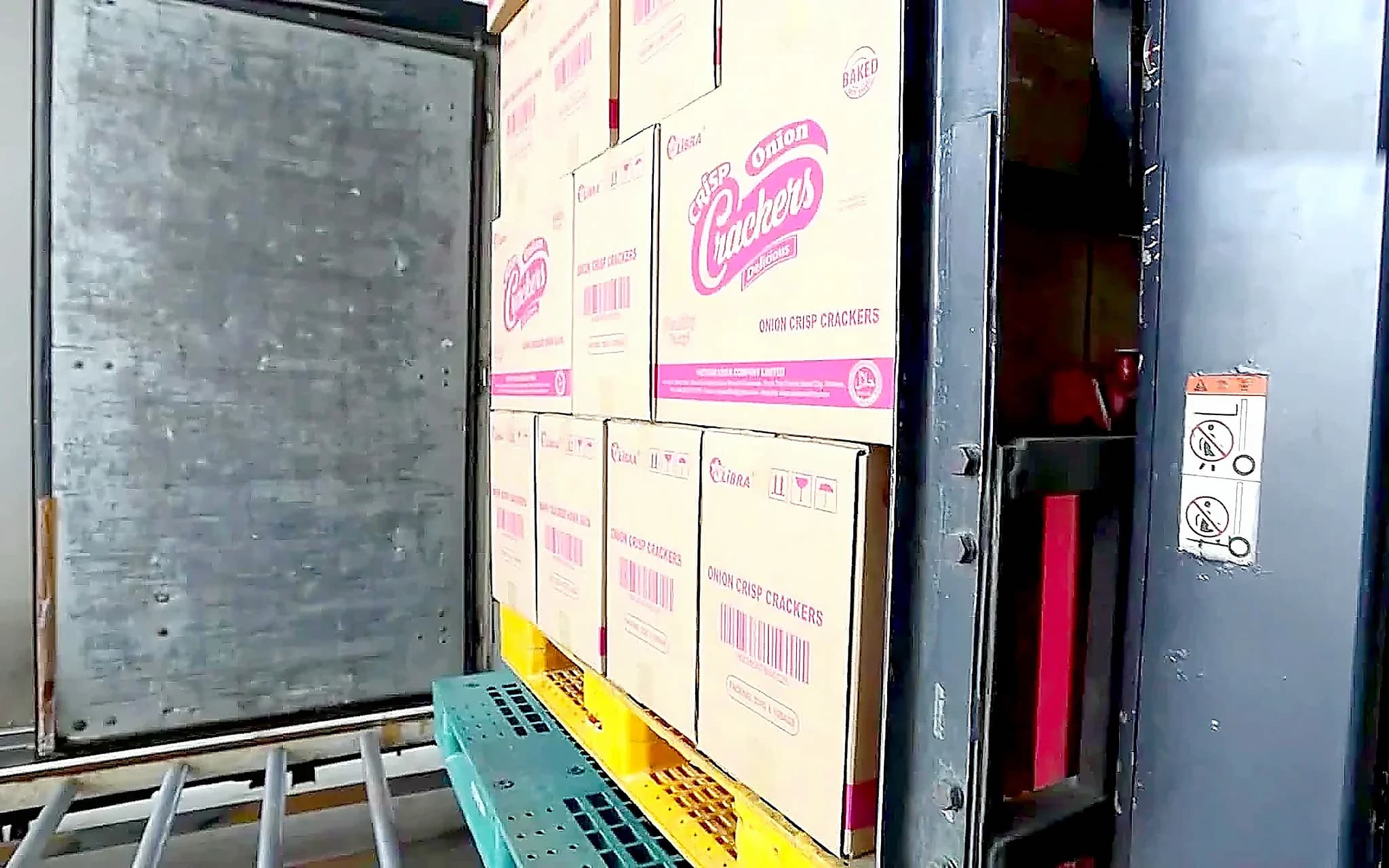 Pallet of Halal-marked LIBRA cartons being loaded for export